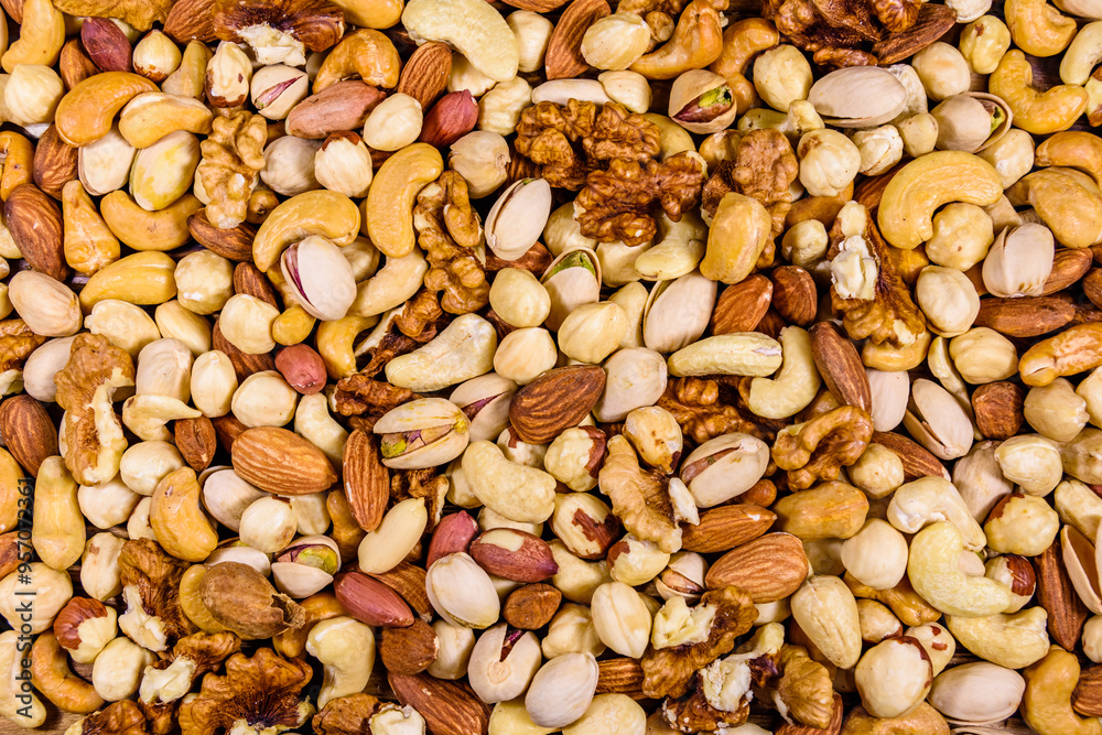 Background of the various nuts (almond, cashew, hazelnut, pistachio, walnut). Vegetarian meal. Healthy eating concept Background of the various nuts (almond, cashew, hazelnut, pistachio, walnut). Vegetarian meal. Healthy eating concept