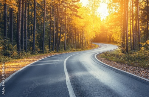 On a beautiful autumn morning, a nice asphalt road leads to the beautiful dolomites.