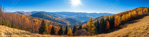 Beautiful autumnal view of the Carpathian Mountains. Autumn leaves on the trees. Rocks on the hilltop.