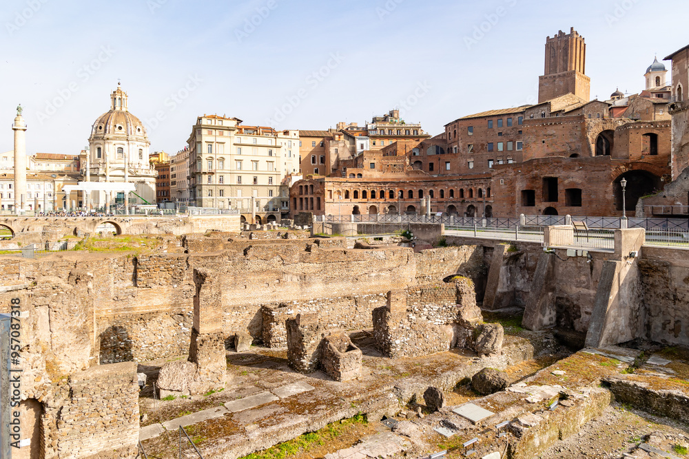 Rome, Italy - April 09, 2024: Ruins of the Roman Forum with tourists strolling among the archaeological remains in Rome, Italy Rome, Italy - April 09, 2024: Ruins of the Roman Forum with tourists strolling among the archaeological remains in Rome, Italy