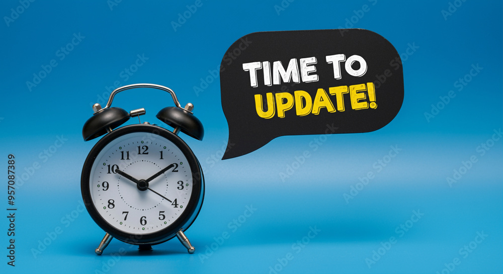 Alarm clock with update message on blue background for business ...