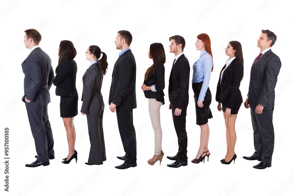 diverse team of business professionals patiently waiting in line diverse team of business professionals patiently waiting in line