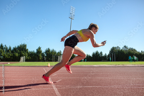 athletic girl training at the stadium photo