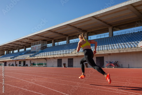 athletic girl training at the stadium