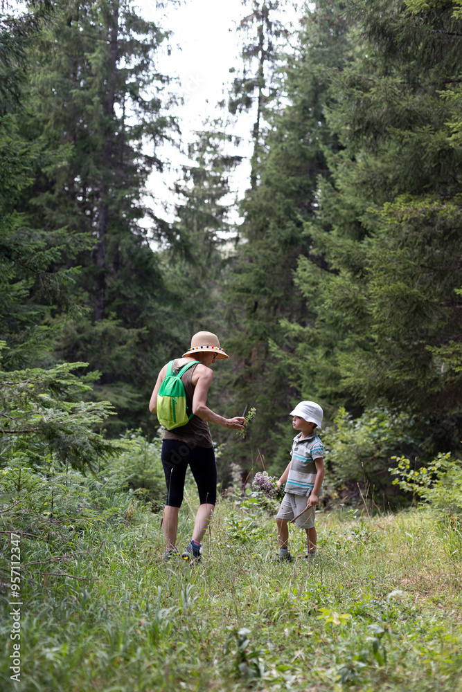 Mother Teaching Son to Forage Wild Oregano Mother Teaching Son to Forage Wild Oregano
