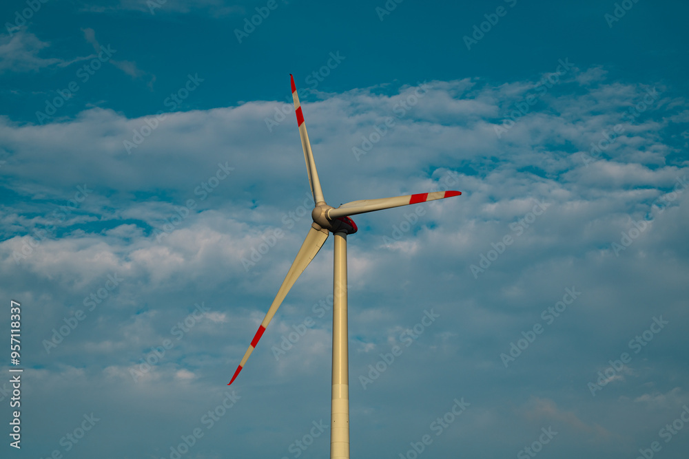 Windmills turbines generating electricity. Green energy. Turbine farm. Renewable energy source. Windmills turbines generating electricity. Green energy. Turbine farm. Renewable energy source.