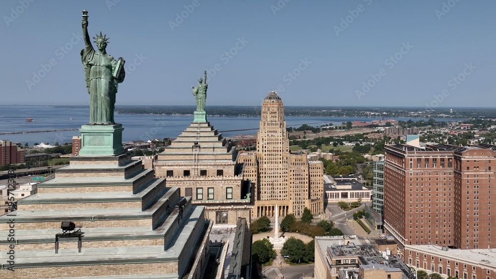 Obraz premium Downtown Buffalo, NY with Buffalo City Hall, office towers in morning sunshine traffic on streets below Liberty Building Art deco architecture