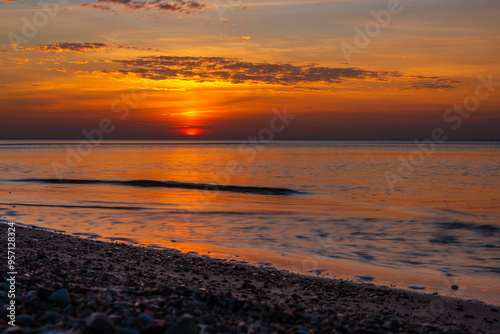 Obraz na płótnie Sandy beach with pebbles of Baltic Sea on Curonian Spit at sunset. Kaliningrad region. Russia w salonie