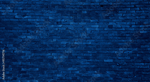 old dark blue brick wall of an old architecture building. brick wall texture. navy blue masonry of stone blocks use as background with blank space for design.