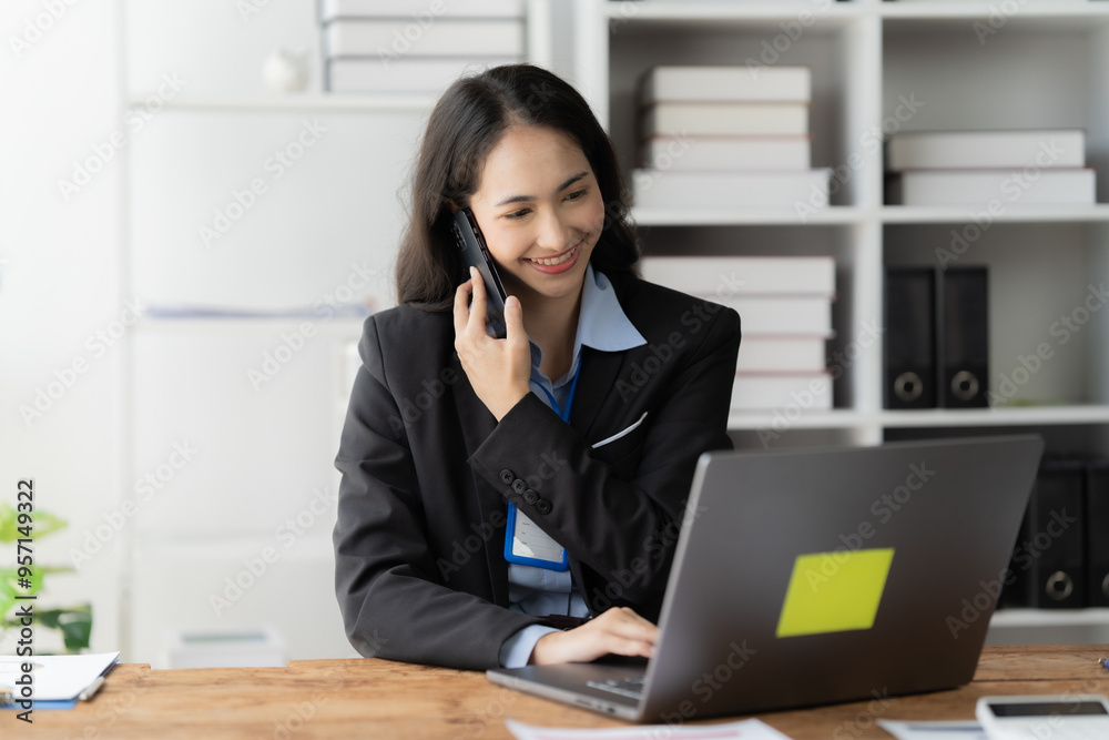 Confident Asian Businesswoman Multitasks in Modern Office Confident Asian Businesswoman Multitasks in Modern Office