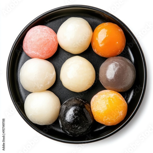 Assorted Mochi in a Black Bowl on White Background photo