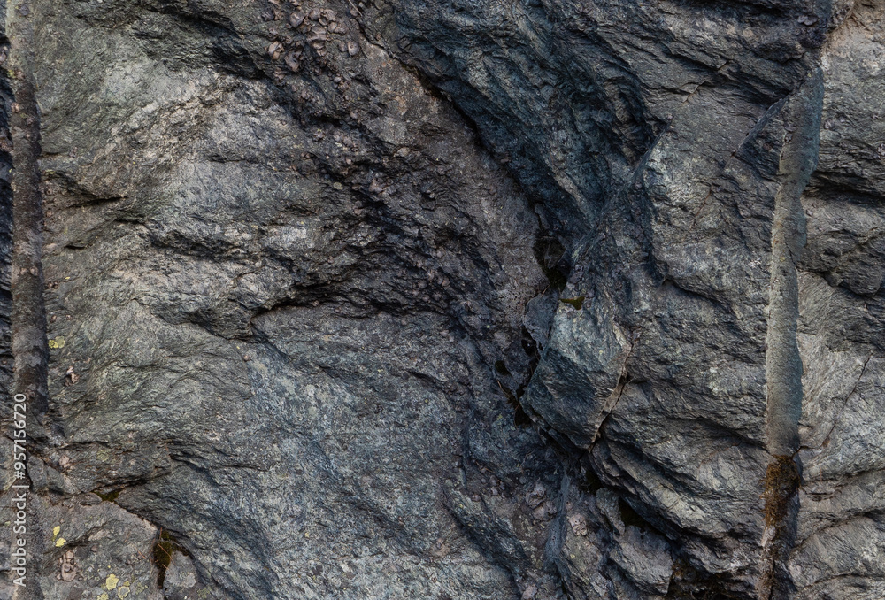 Rugged Textured Rock Surface with Geological Patterns. Gray Rock texture. Rock layers Rugged Textured Rock Surface with Geological Patterns. Gray Rock texture. Rock layers