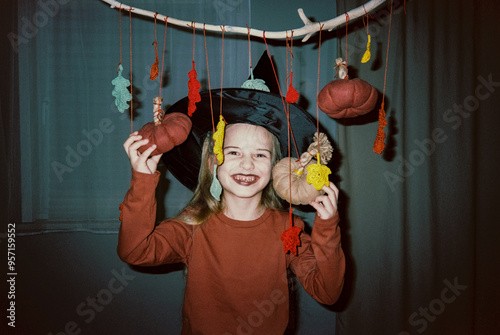 Smiling girl with halloween decorations