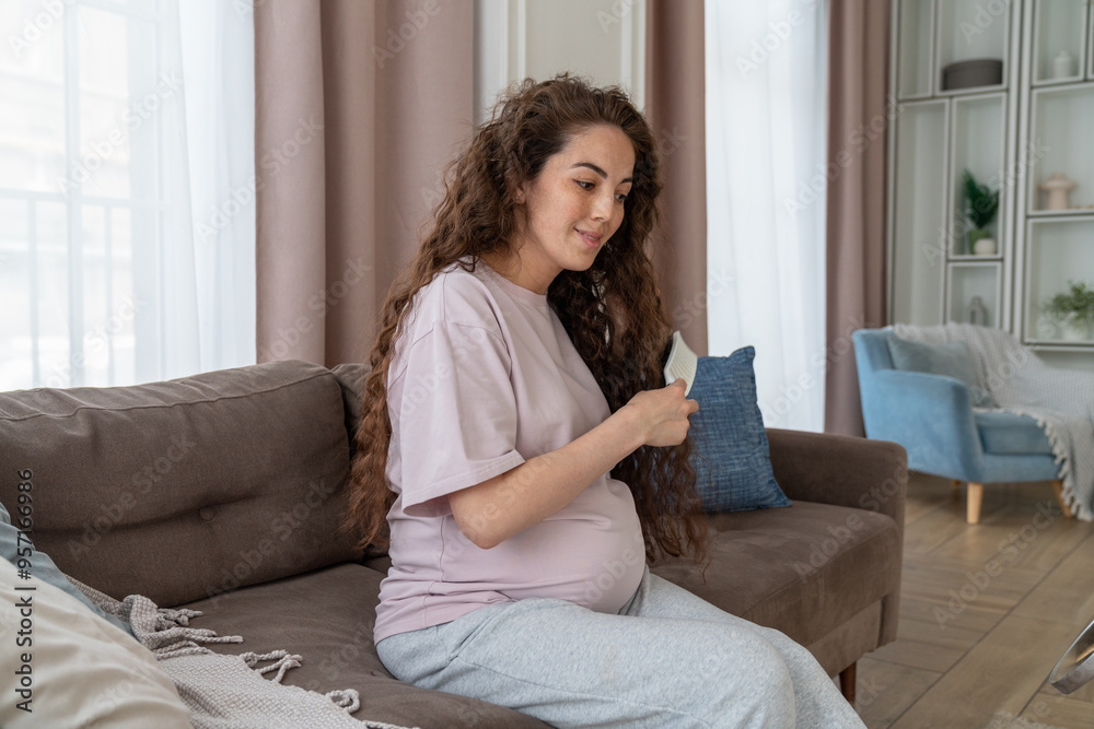 Pregnant Woman Combing Long Hair at Home Pregnant Woman Combing Long Hair at Home