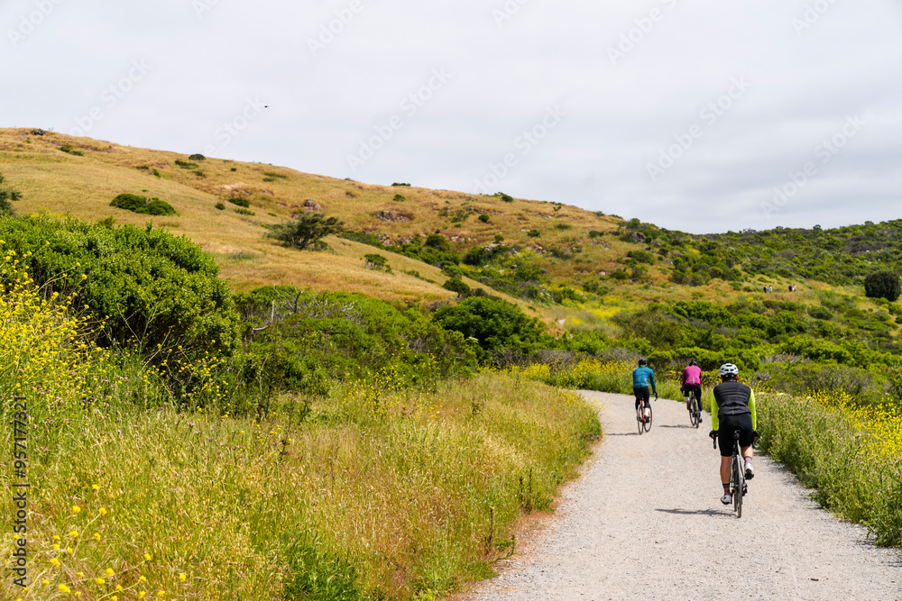 Group biking together on gravel path Group biking together on gravel path