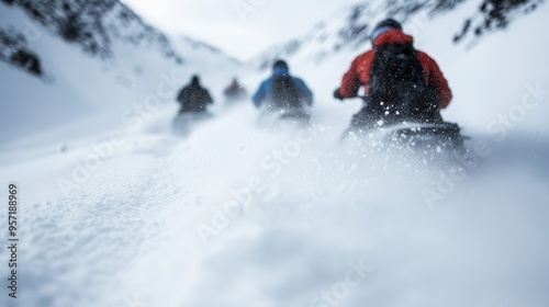 A group of snowmobile riders is captured speeding through snowy mountain paths, leaving a trail of snow, symbolizing the thrill and adrenaline of winter sports and adventure.