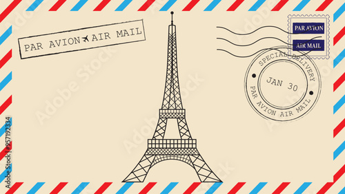 eiffel tower and postal stamps on envelope