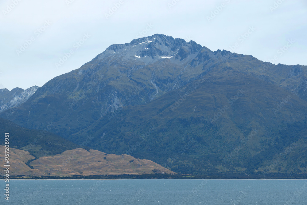 The gigantic brown mountains near Lake Wanaka in summer season. The gigantic brown mountains near Lake Wanaka in summer season.