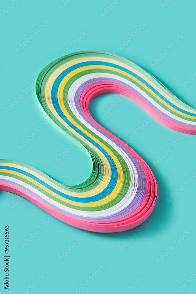 Colourful decorative papers laying in swirls in minty studio Colourful decorative papers laying in swirls in minty studio