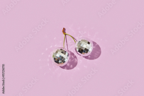 Two silver disco balls in form of berries connected by cheery stem