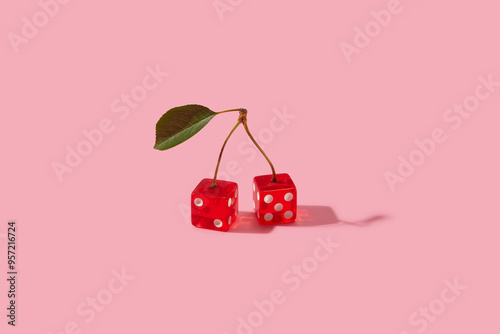 Couple of red dices with white dots connected with berry stems