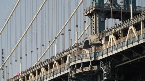 Close-up of the Manhattan Bridge's steel cables and beams, emphasizing the detailed craftsmanship. 