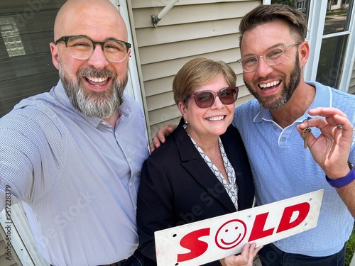 UGC - New Homeowners Celebrating with Real Estate Agent photo