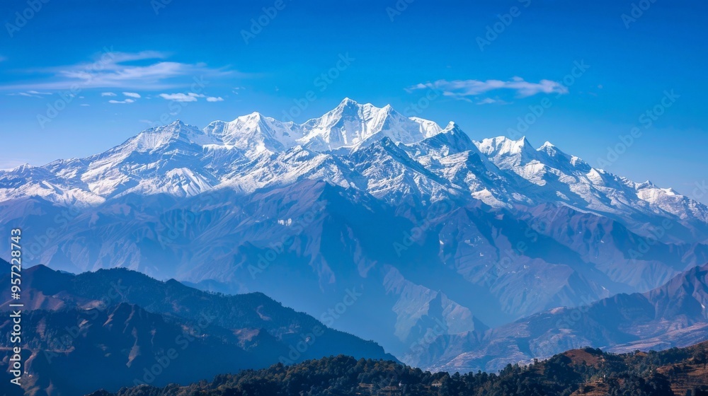 Majestic mountain range with snow-capped peaks under a clear blue sky Majestic mountain range with snow-capped peaks under a clear blue sky