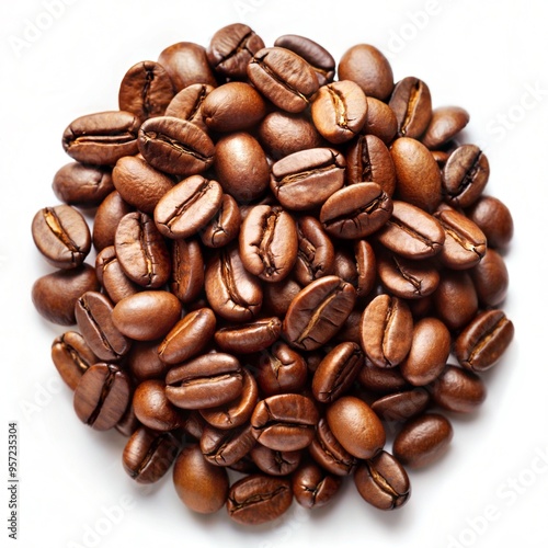 Close-up of roasted coffee beans piled together on a white background