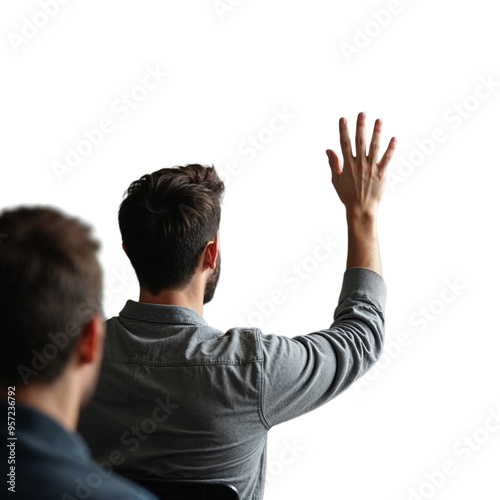 A man raises his hand to ask a question during a meeting or lecture