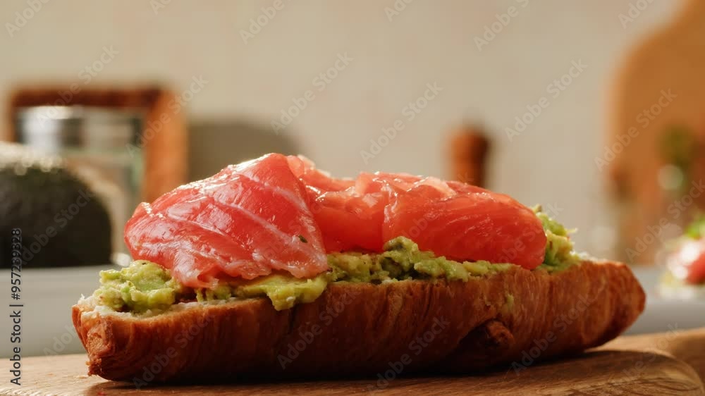 Delicious Croissant Sandwich made with Egg and Avocado and salmon, traditional french cuisine, france cafe, morning breakfast brunch menu. Delicious Croissant Sandwich made with Egg and Avocado and salmon, traditional french cuisine, france cafe, morning breakfast brunch menu.