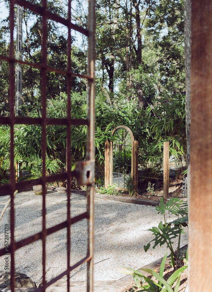 Rusty gate entry to a garden Rusty gate entry to a garden