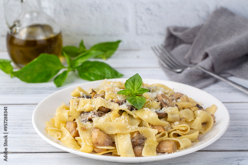 Creamy Alfredo pasta with chicken, mushrooms and parmesan cheese. Healthy Italian food.