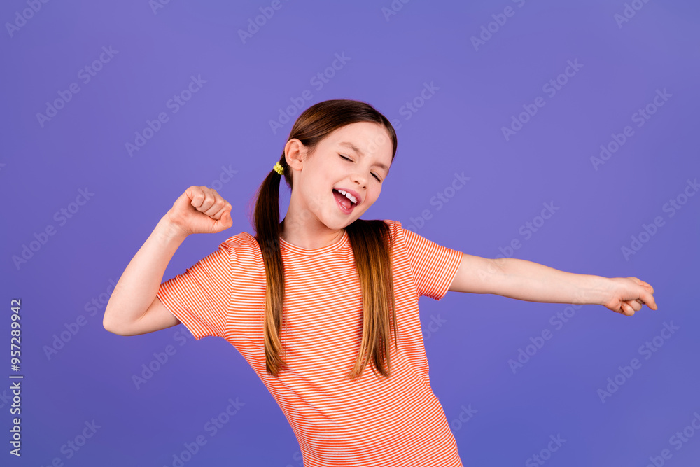 Fototapeta premium Photo portrait of cute little girl dancing good mood dressed stylish red clothes isolated on violet color background