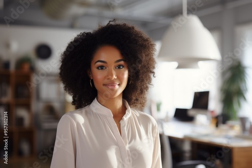 Smiling portrait of a young hipster woman in office