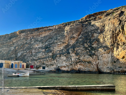 Fishing boats on the coast of Xlandi Bay, the island of Gozo, Malta.  photo