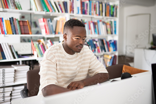 Student studying in bright library