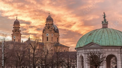 The Diana pavilion temple with statue of Bavaria in the center of the Court Garden residence Garden in Munich timelapse during sunset. Baroque church Theatinerkirche in the background. Germany photo