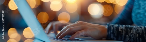 Wallpaper Mural A person typing on a laptop with bokeh lights in the background, illustrating productivity, technology, and creativity. Torontodigital.ca
