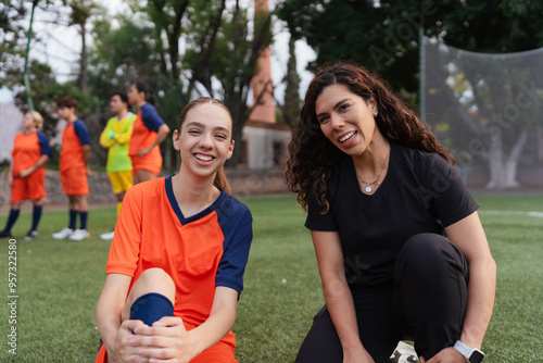 Portrait of a player and doctor in a football field. photo