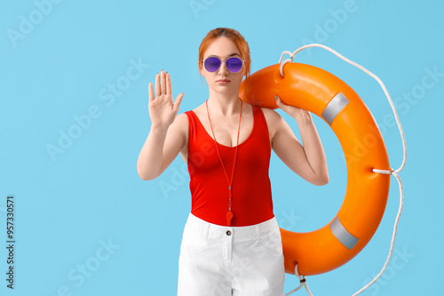 Female lifeguard with ring ...