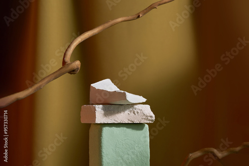 Abstract Sculpture With Blocks And Branch On Colored Background photo