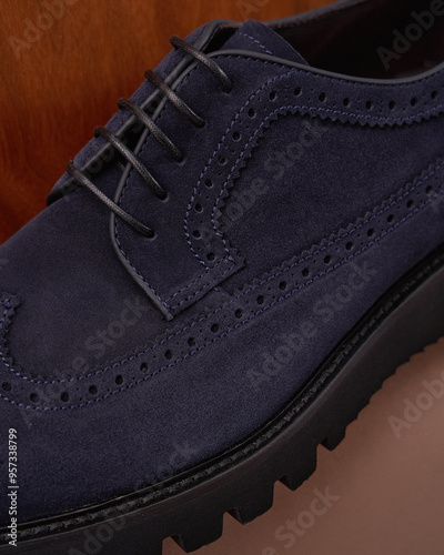 Blue Suede Brogue Shoe on Wood Background