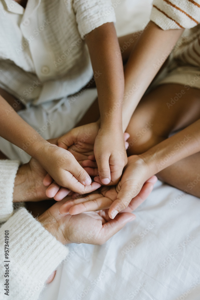 Close-up of mother and kids' hands 
