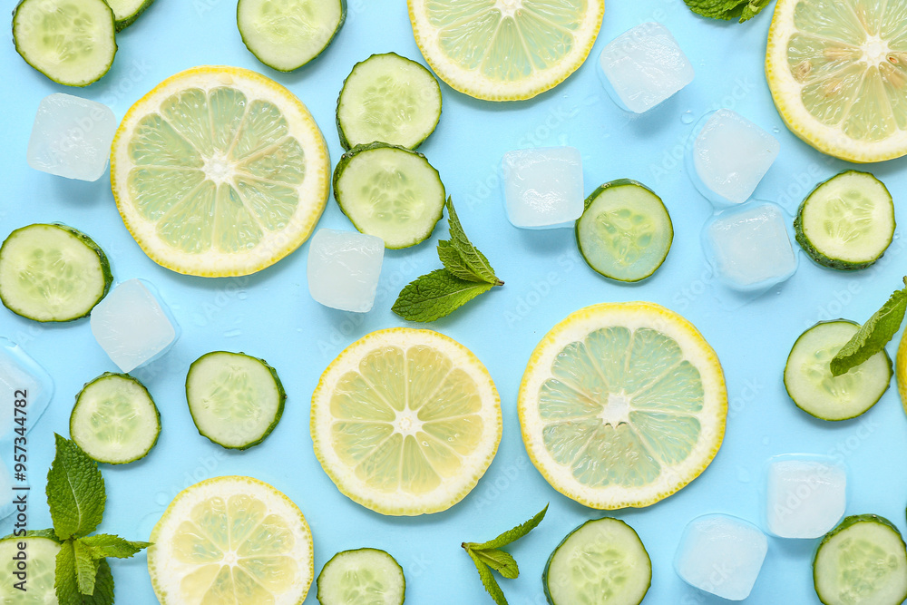Lemon with cucumber, mint and ice cubes on blue background. Ingredients for mojito Lemon with cucumber, mint and ice cubes on blue background. Ingredients for mojito