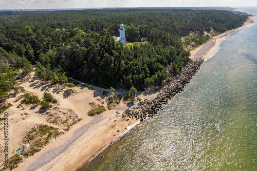 Uzava, Latvia - August 06, 2024. The lighthouse is located in Uzava parish, about 20 kilometers south of Ventspils. It was built in 1879 at an altitude of 28 meters above sea level. photo