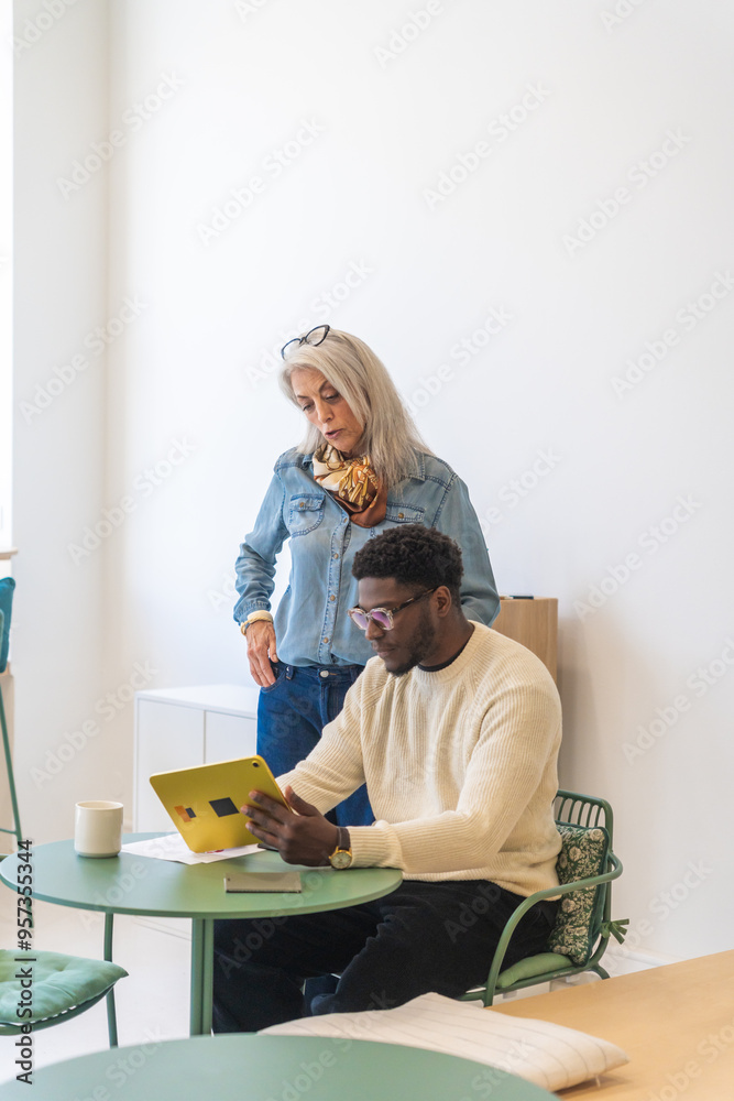 Professional Collaboration On Tablet In Modern Office. Professional Collaboration On Tablet In Modern Office.