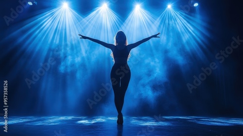 Dancer performing on a stage with spotlight