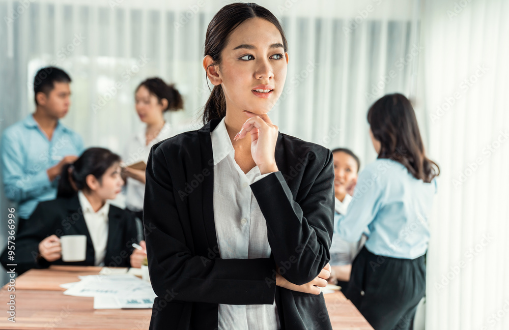 Portrait of happy young asian businesswoman looking at camera with motion blur background of business people movement in dynamic business meeting. Habiliment Portrait of happy young asian businesswoman looking at camera with motion blur background of business people movement in dynamic business meeting. Habiliment