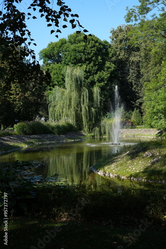 park, fountain, atmosphere, image, picturesque, reflection, calm, natural, serene, outdoor, light, setting, scene, water, lush, greenery, tree, pond
